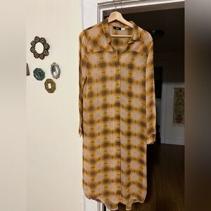 Long silk button-down blouse perfect for layering in brown and tan tones